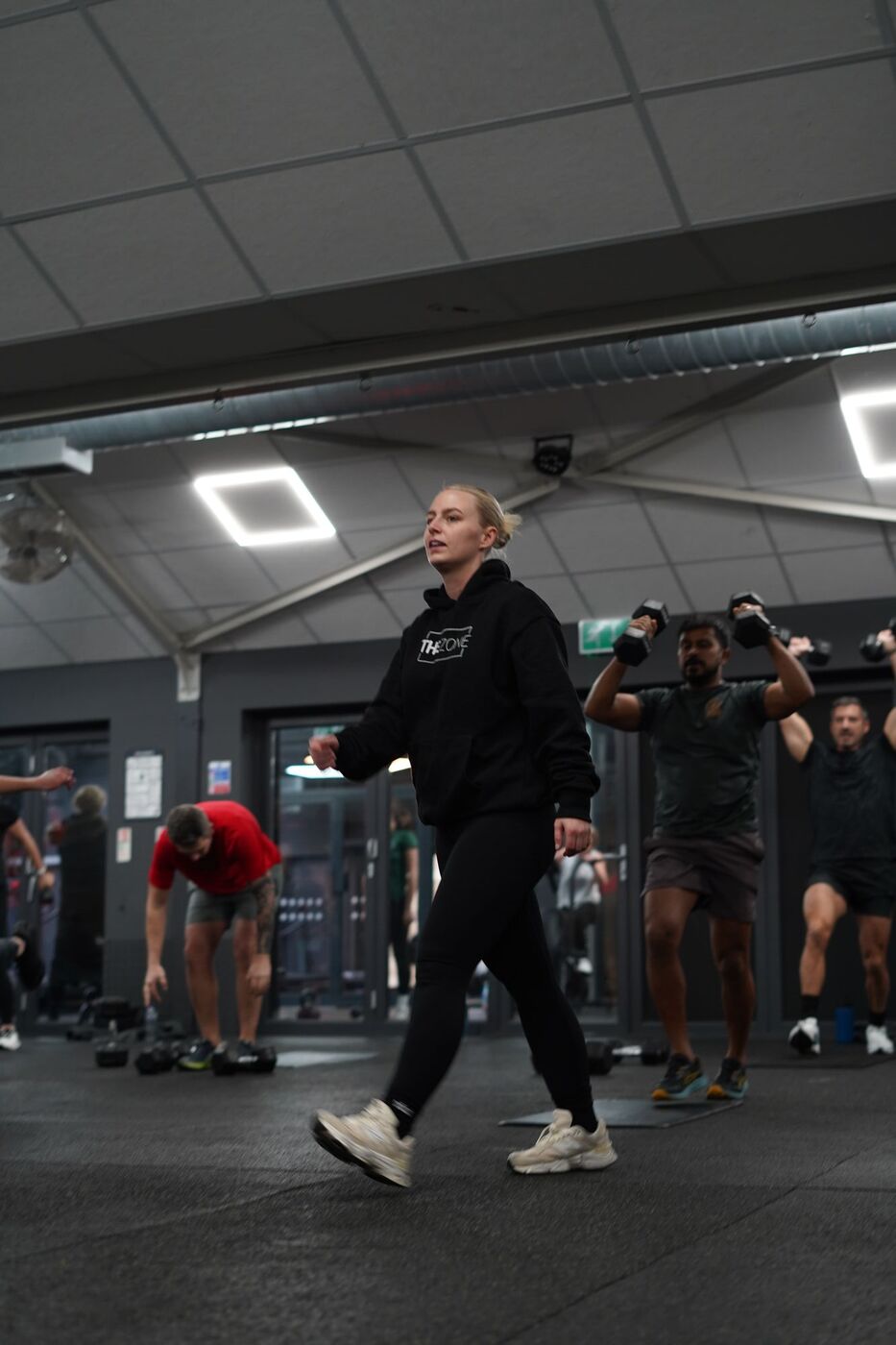 Coach leading the Sweat & Sculpt class
