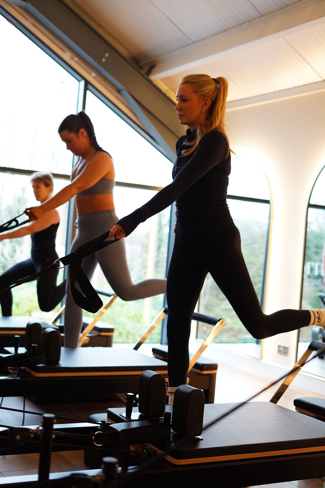 Reformer Pilates class in the studio